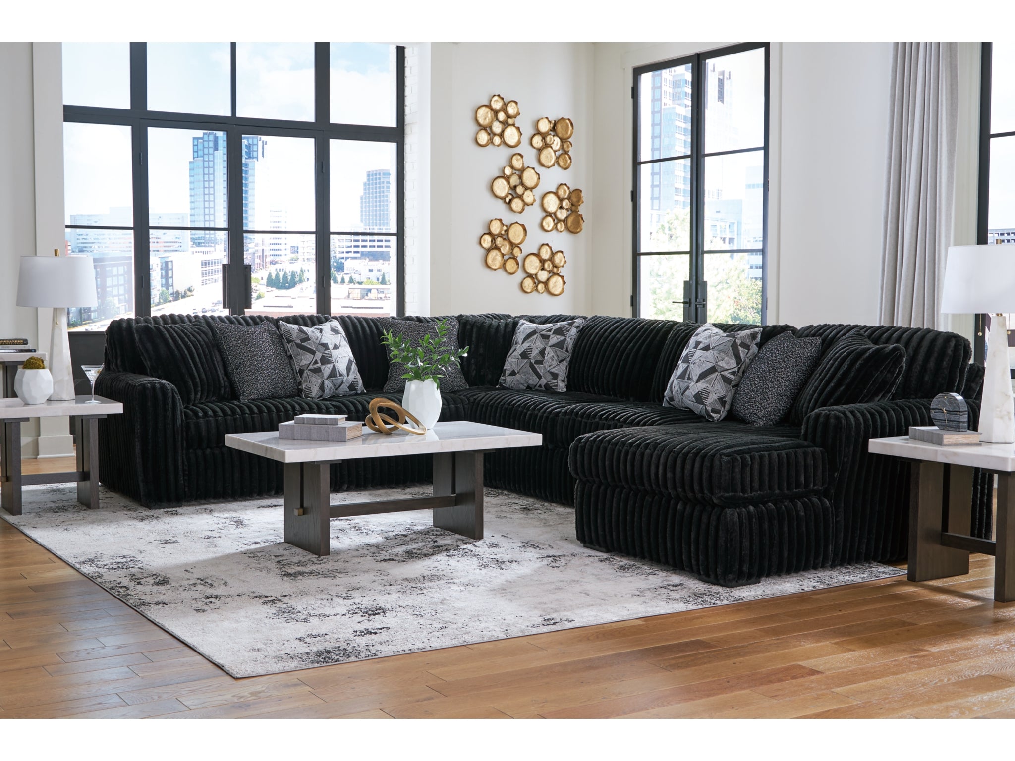 Ashley Furniture black sectional sofa in modern living room - available at Bubba's Mattress & Furniture Louisville KY